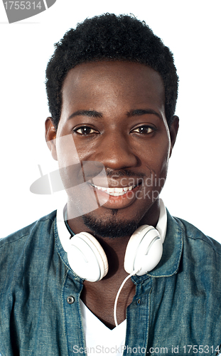 Image of Guy with headphones around his neck