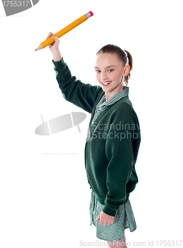 Image of Attractive little girl writing in copy space area