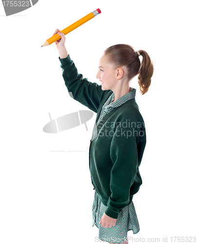 Image of Adorable pretty girl writing over copy space