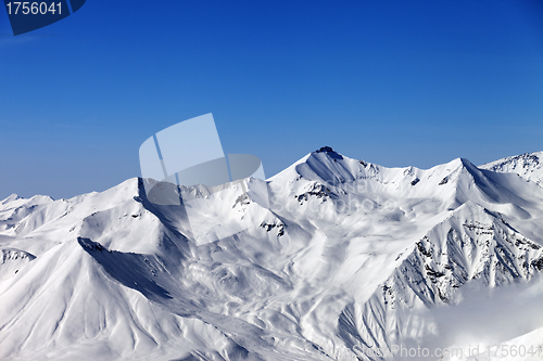 Image of Snowy mountains and blue sky