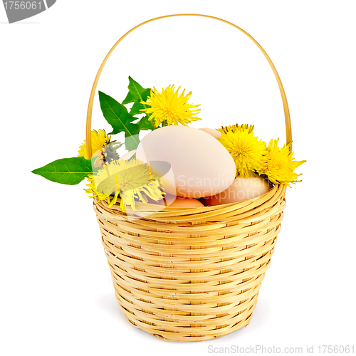 Image of Eggs in a basket with dandelions