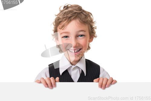 Image of Little boy is peeking from blank sign