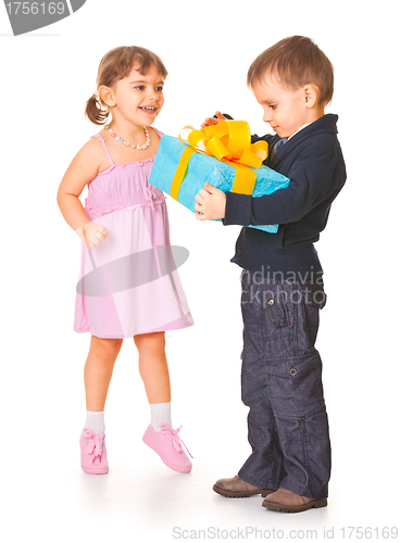 Image of Little boy  giving a gift box to her girlfriend