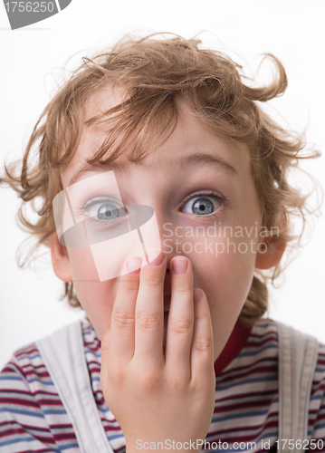 Image of curly-haired boy surprised