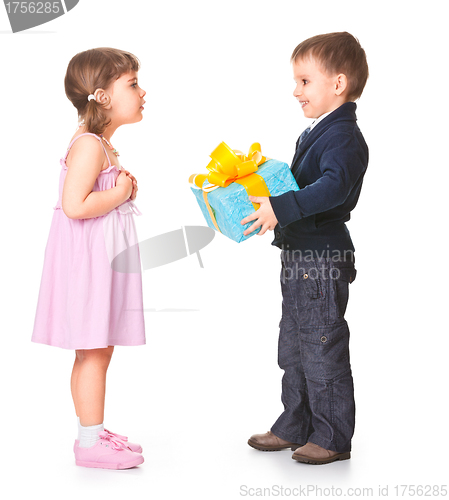 Image of Little boy  giving a gift box to her girlfriend