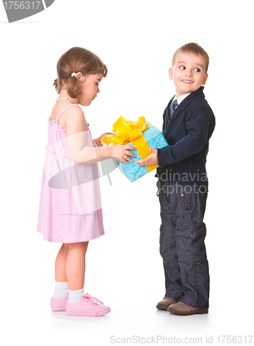 Image of Little boy  giving a gift box to her girlfriend