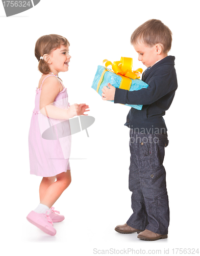 Image of Little boy  giving a gift box to her girlfriend