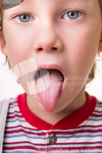 Image of toddler shows tongue