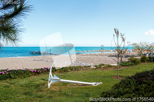 Image of empty beach with anchor