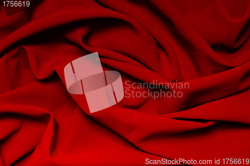 Image of The folds of a bright red cloth. Abstract Background