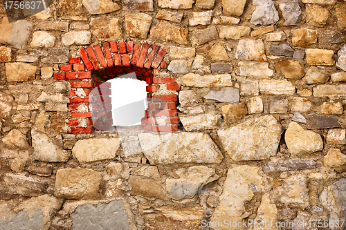 Image of Old wall of castle with a window