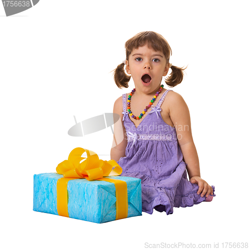 Image of Little girl in shock from a large gift