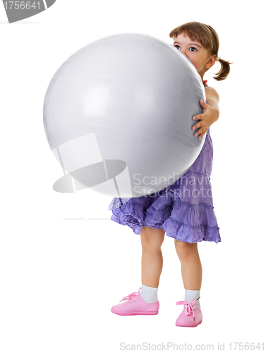 Image of Little girl has a huge ball on white background