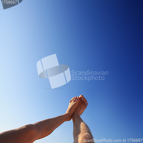 Image of beautiful feet of man and woman in the summer