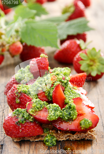 Image of Strawberry toast with pesto and fresh strawberries.