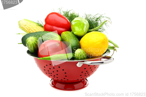 Image of Summer vegetables in metal colander.