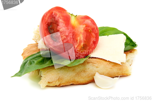 Image of Pita bread, tomato, cheese and basil.