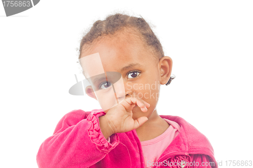 Image of Playful little girl with a finger in her mouth