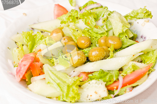 Image of Tasty salad served in a bowl