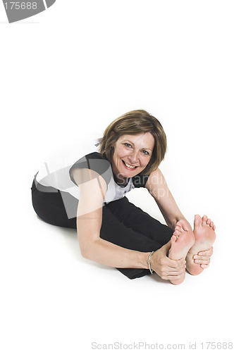 Image of woman in white t-shirt doing yoga