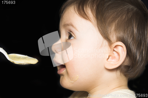 Image of baby being fed with spoon