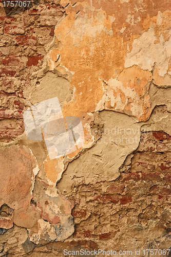 Image of Old brick wall with ragged plaster
