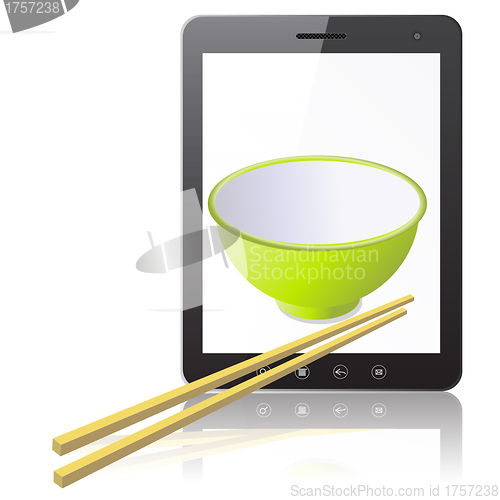 Image of Tablet PC computer with ceramic mug with wooden sticks 