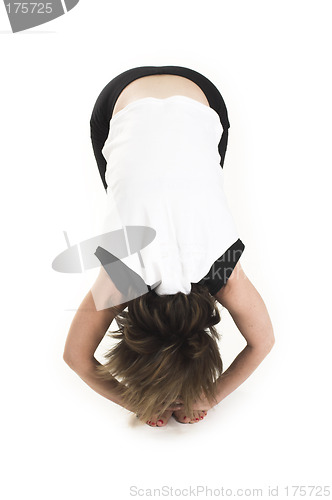 Image of woman in white t-shirt doing yoga