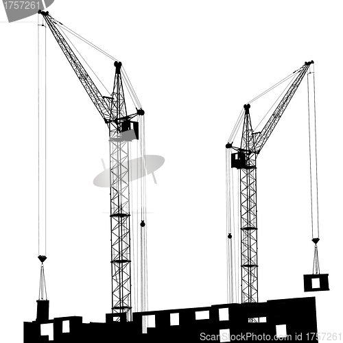 Image of Silhouette of two cranes working on the building