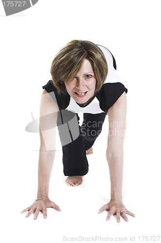 Image of woman in white t-shirt doing yoga