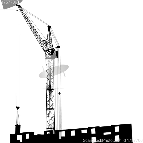 Image of Silhouette of one cranes working on the building