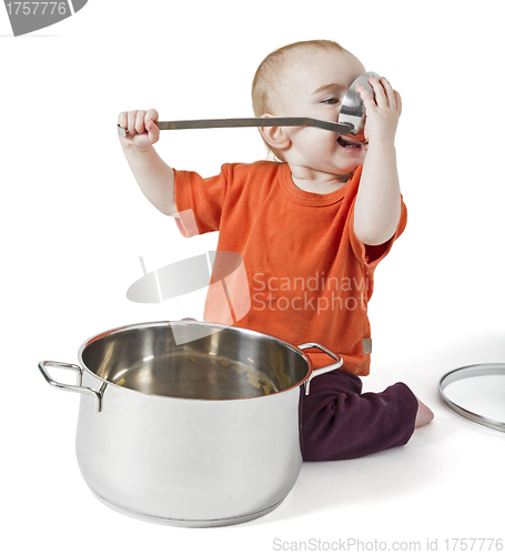 Image of baby with big cooking pot