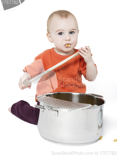 Image of baby with big cooking pot