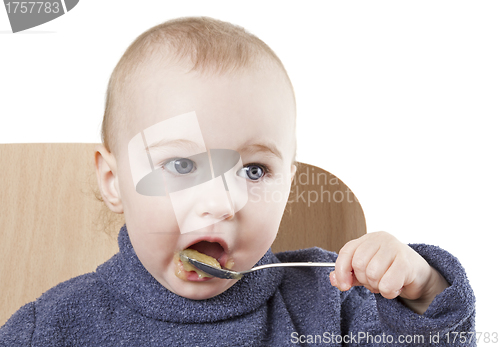 Image of baby eating applesauce