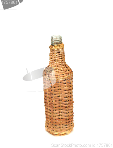 Image of Empty transparent bottle in wood, on white