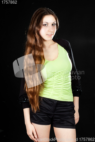 Image of beautiful girl posing on black background