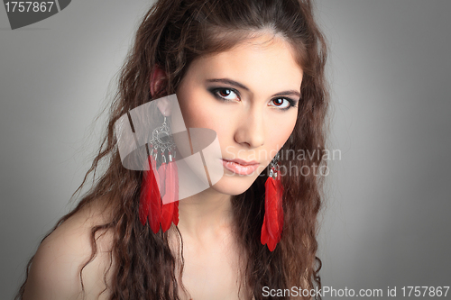 Image of cute girl with beautiful red earrings