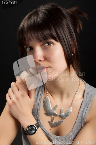 Image of Portrait of brunette girl on dark background