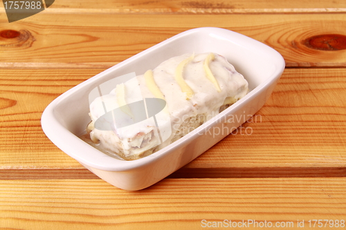 Image of white lasagna isolated on wooden background