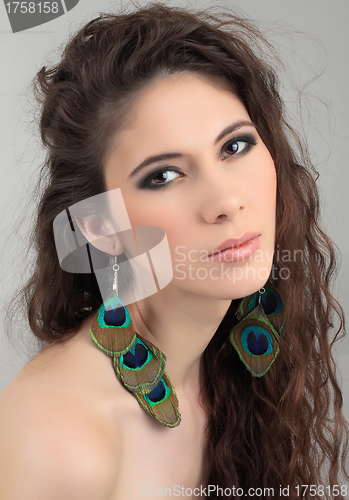 Image of Portrait of beautiful girl with cute earrings