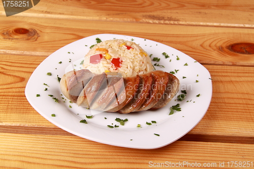 Image of fried rice with vegetables and cut sausage