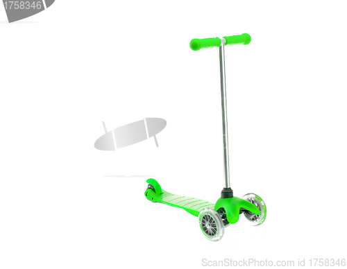 Image of children green scooter isolated on white.