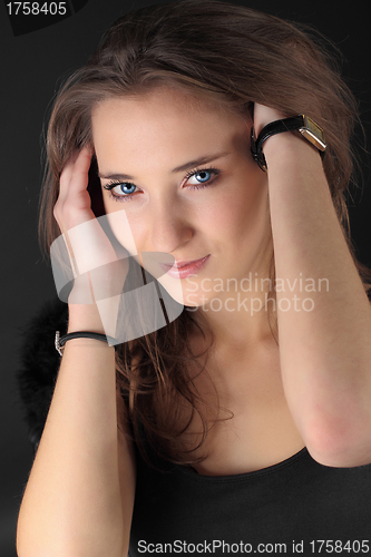 Image of beautiful young girl smiling, on gray background