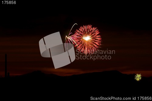 Image of Firecrackers In The Sky During Sunset