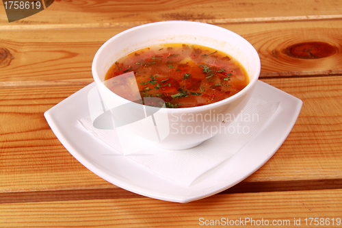 Image of Bowl of Bright Red Creamy Tomato Soup with Yogurt