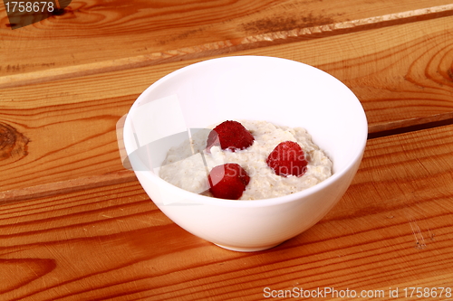 Image of Fresh strawberries in a glass dish on white background.