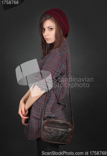 Image of young beautiful girl posing on black background