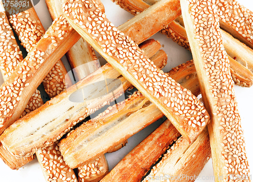 Image of appetizing baking sticks with sesame