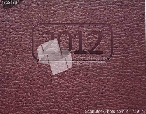 Image of Year 2012 text on leather background