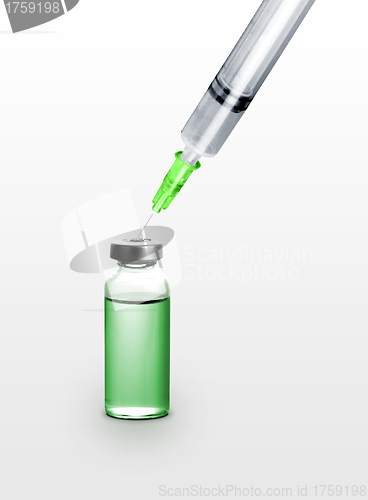 Image of syringe with drug bottle